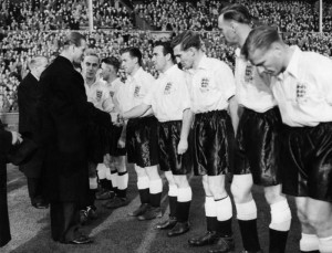Home International match at Wembley Stadium. England 5 v Wales 2. England player Alf Ramsey shakes hands with Prince Philip, the Duke of Edinburgh, before the match. 12th November 1952. Image courtesy of Mirrorpix.